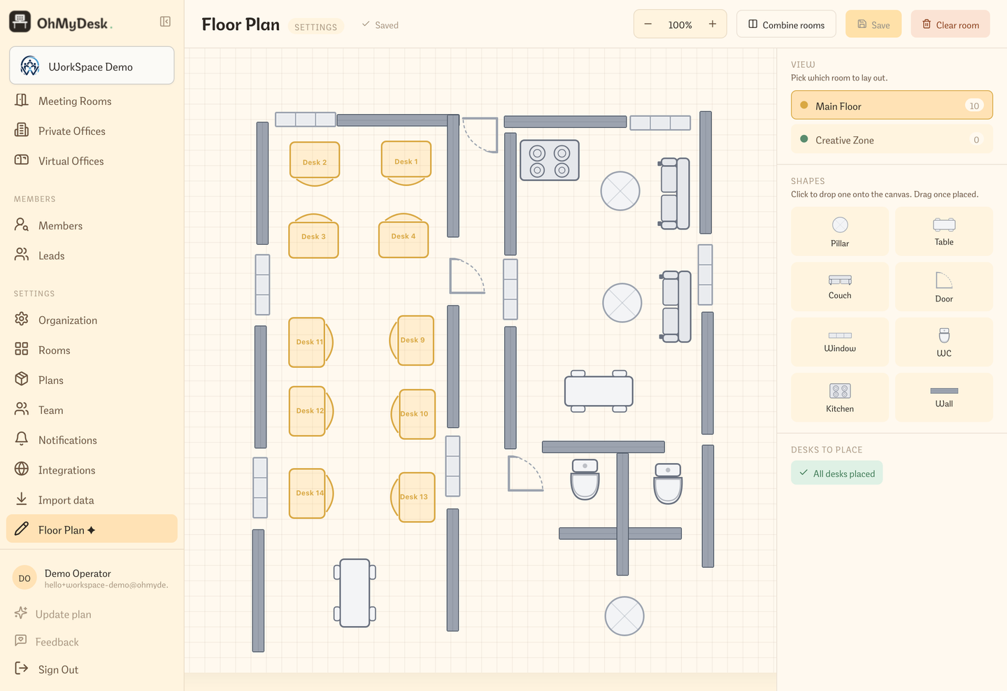 Floor plan editor canvas with desks and furniture placed on an interactive grid